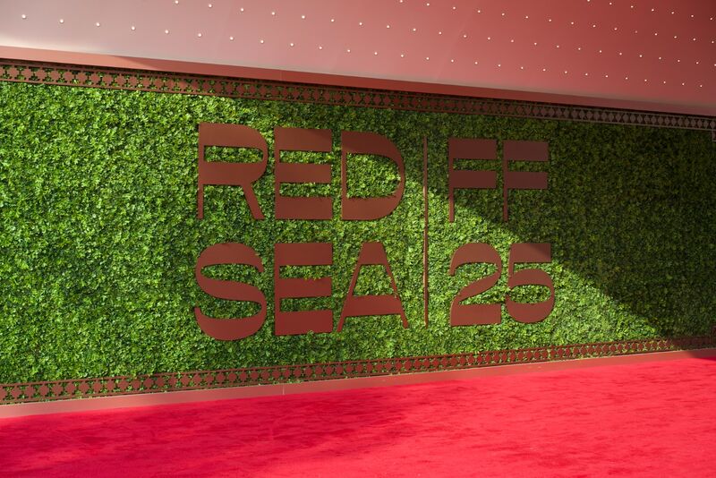 Red carpet floor against a green wall with RED SEA IFF letters.