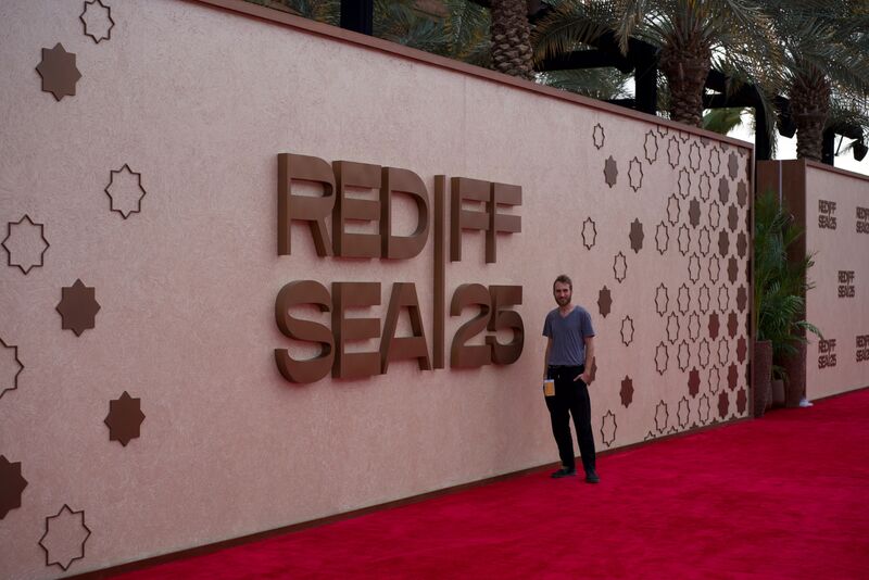 Stucco wall with star motifs and large RED SEA IFF 25 lettering.
